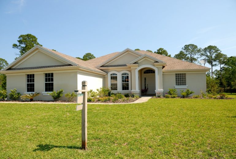 A home for sale on a sunny day.