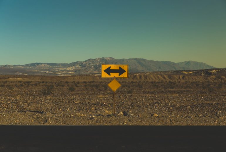 A street sign showing the road runs in both directions.