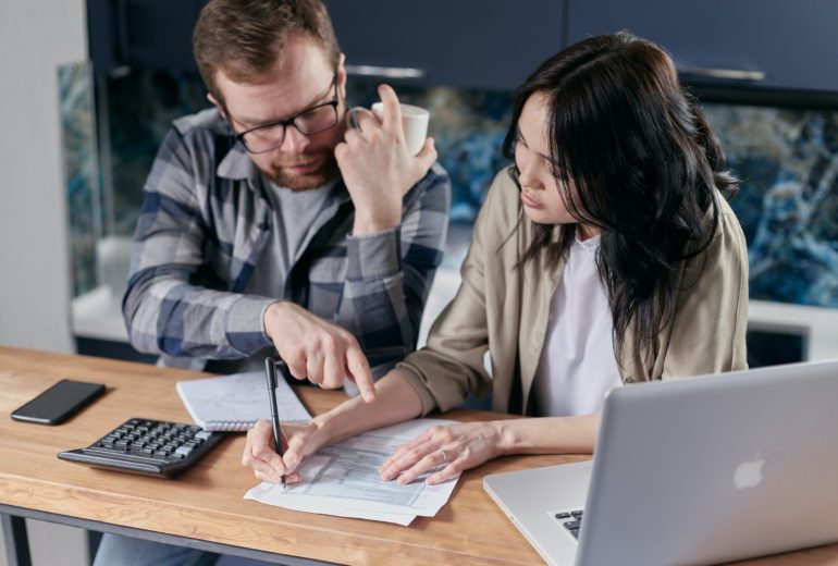 A couple reviewing their finances together.