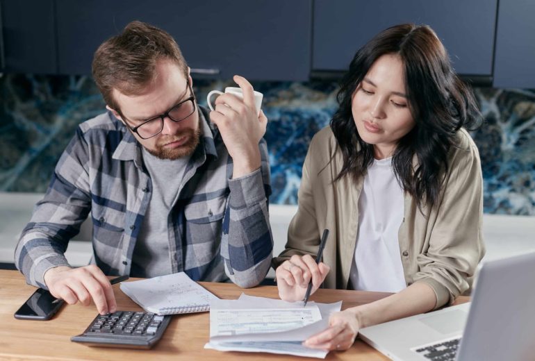 A couple reviewing their finances together.