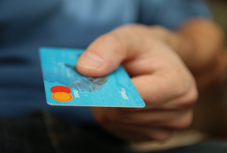 Close-up of someone holding a credit card.