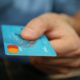 Close-up of someone holding a credit card.